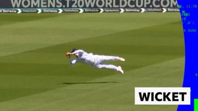 Jacob Bethell flies through the air to catch a ball by New Zealand's Tom Latham.