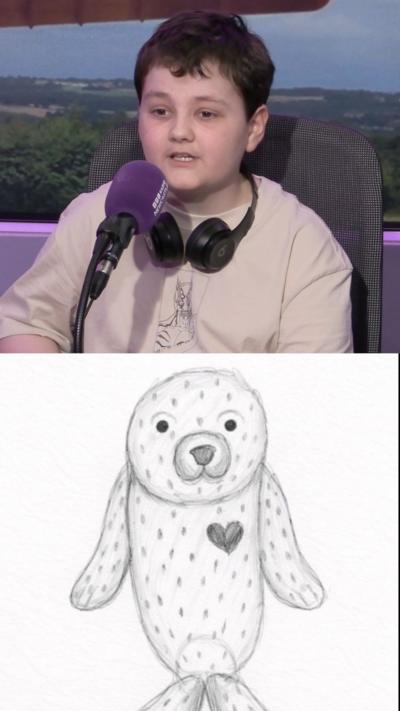 Boy sits in radio studio with headphones on. The image also shows a drawing made by the boy of a seal.