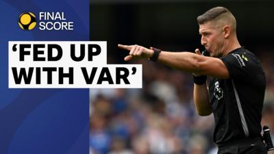 Premier League referee Robert Jones blows his whistle and points