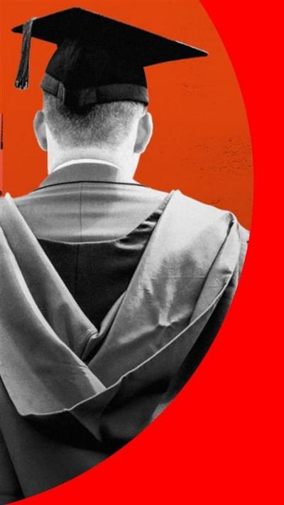 A person in graduation robes standing with their back to the camera.