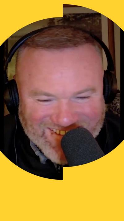 Wayne Rooney with a headset and microphone