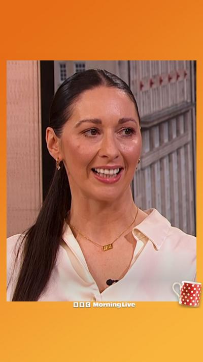 Rachel Duffy shoulders upwards in a white blouse with her hair slicked back