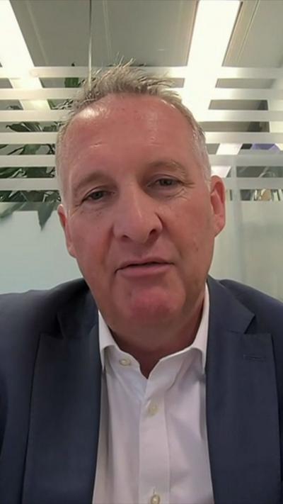 John Whitehurst, Chief Executive of Greater Thameslink Railway in a suit.