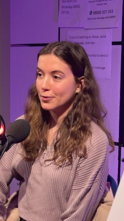 Amy Hudson sitting in the BBC Radio Derby studio