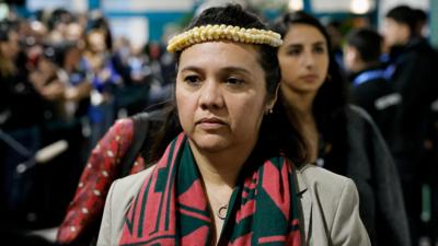 Marshall Islands Climate Envoy Tina Stege walking out of a meeting