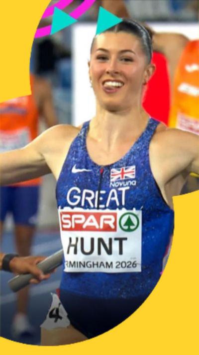 Amy Hunt smiles as she crosses the line to win gold