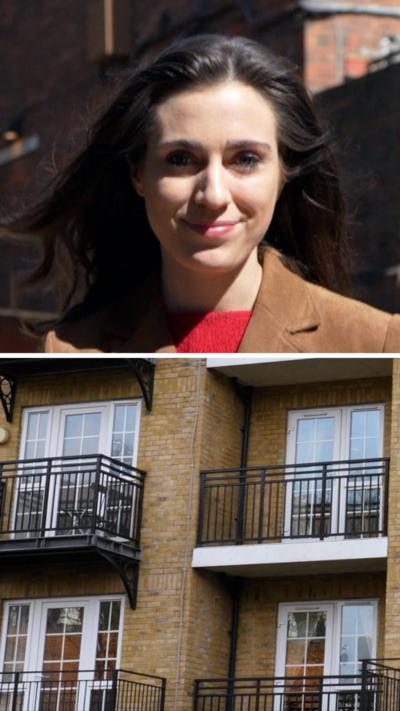 Split screen. Woman reporter looking directly to camera in top half. Bottom half shows block of flats.