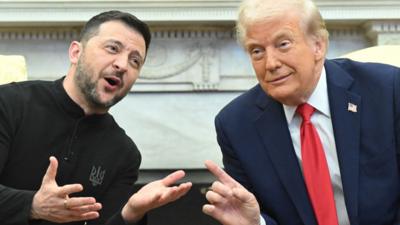 Close up shot of Zelensky and Trump smiling in Oval Office