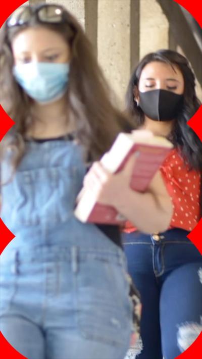 Two women with face masks 