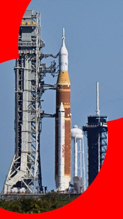 The rocket being transported against the blue sky