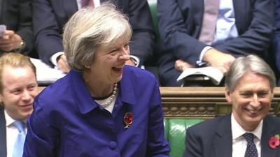 Theresa May laughing at PMQs