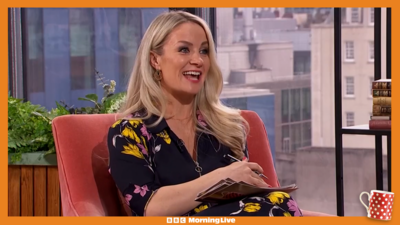 Holly Hamilton in a flowery jumpsuit in the Morning Live studio