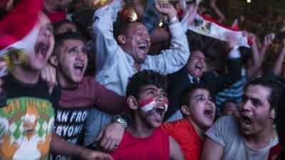 Egyptian football fans celebrate