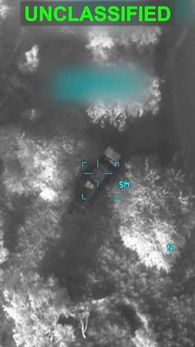Still from black white video of a US strike with the word CLASSFIED written at the top
