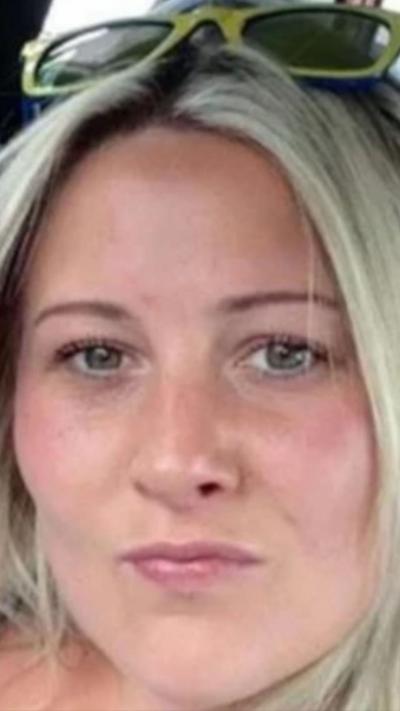 Joanne Penney, the woman who was murdered, who has blonde hair, brown eyes and yellow sunglasses on her head.
