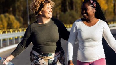 Two women exercising outside