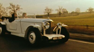 Nationwide presenter Sue Cook driving in an open top Mallalieu Barchetta car.