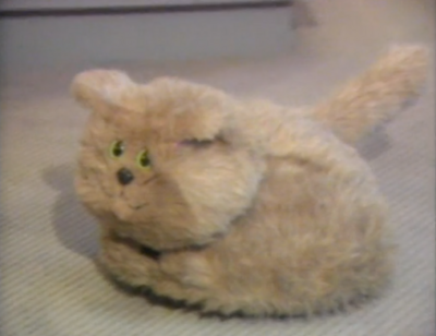 Golden brown fluffy toy cat - smiling!