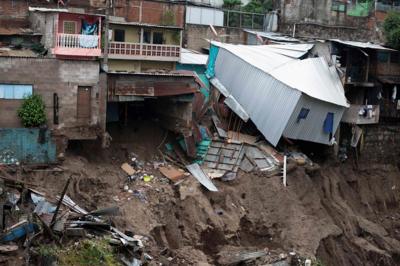 Houses slip after flooding from Tropical Storm Amanda