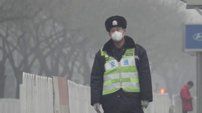 A policeman with an air-filter mask