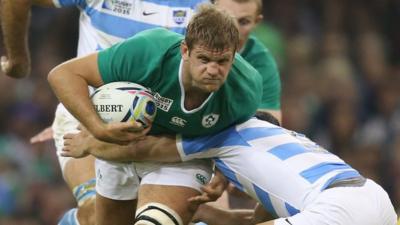 Ireland flanker Chris Henry is tackled in the World Cup quarter-final defeat by Argentina