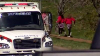 children evacuate after school shooting