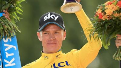 Tour De France winner Chris Froome celebrates