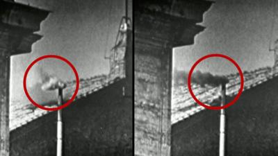 A black and white split image of a chimney with white smoke and the other side with black smoke