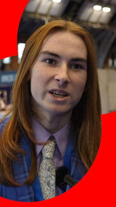 Young man at Conservative Party conference wearing a tartan suit and a patterned tie