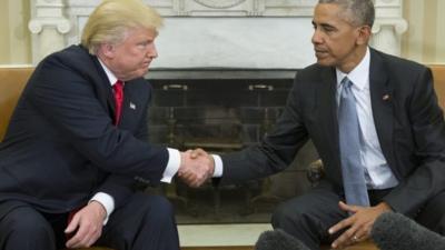 A file picture dated 10 November 2016 shows US President Barack Obama shaking hands with President-elect Donald Trump at the end of their meeting in the Oval Office