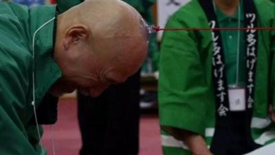 Japanese men compete in a tug-of-war contest