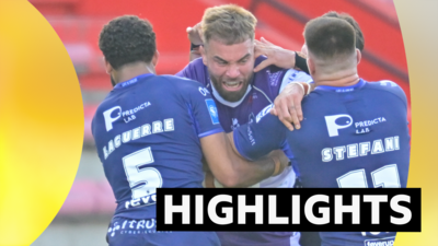 Wakefield player tackled by two Toulouse players