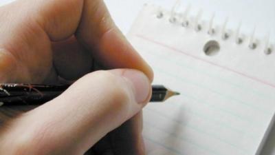 A pen poised to write