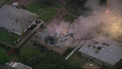 The two homes hit by the plane were badly damaged