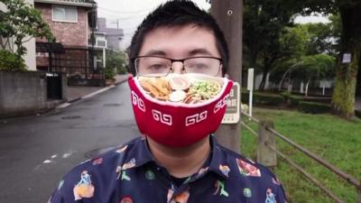 Man wearing a ramen face mask