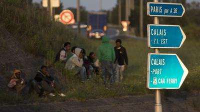 Migrants by the roadside in Paris