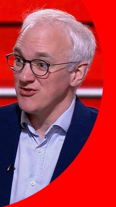 James Gallagher in blue suit speaking in the BBC News studio