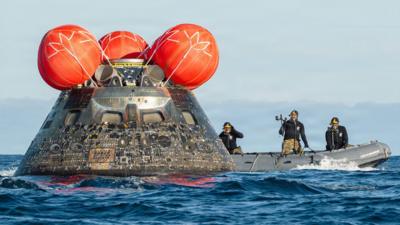 Artemis II capsule in the sea.