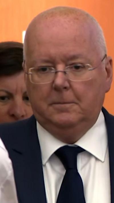 Man in dark suit and tie