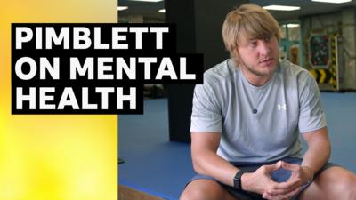 Paddy Pimblett sat down in a gym