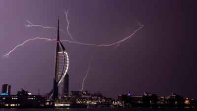 Lightning flashes near the Spinnaker Tower in Portsmouth.