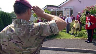 Regimental salute at Duncan's home