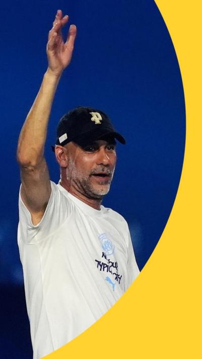 Pep Guardiola waving at the Manchester Parade after party