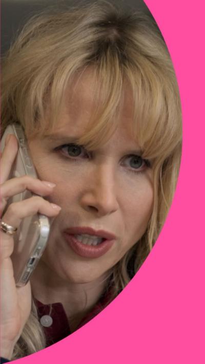 Lucy Punch as Amanda on the phone to someone, looking concerned.