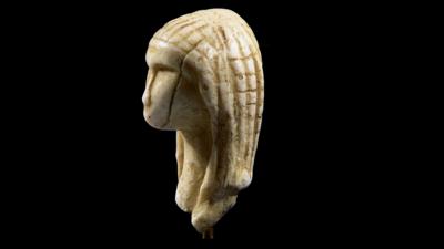 Early ivory carving of a human head