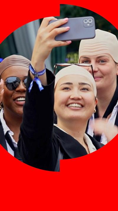 Pitbull fans wearing bald caps and taking a selfie