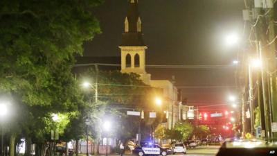 Night shot of the Emanuel African Methodist Episcopal Church in Charleston with police vehicle by the church