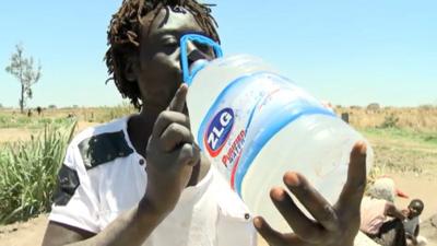 Community member drinking water