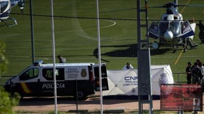 A body, believed to be of former Spanish Olympic skier Blanca Fernandez Ochoa, is surrounded by Spanish forensic technicians