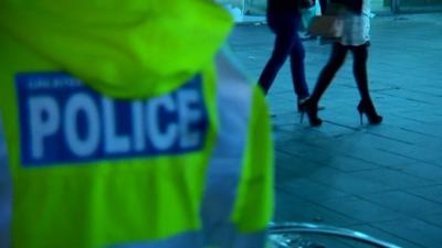 Policeman and two unidentified women